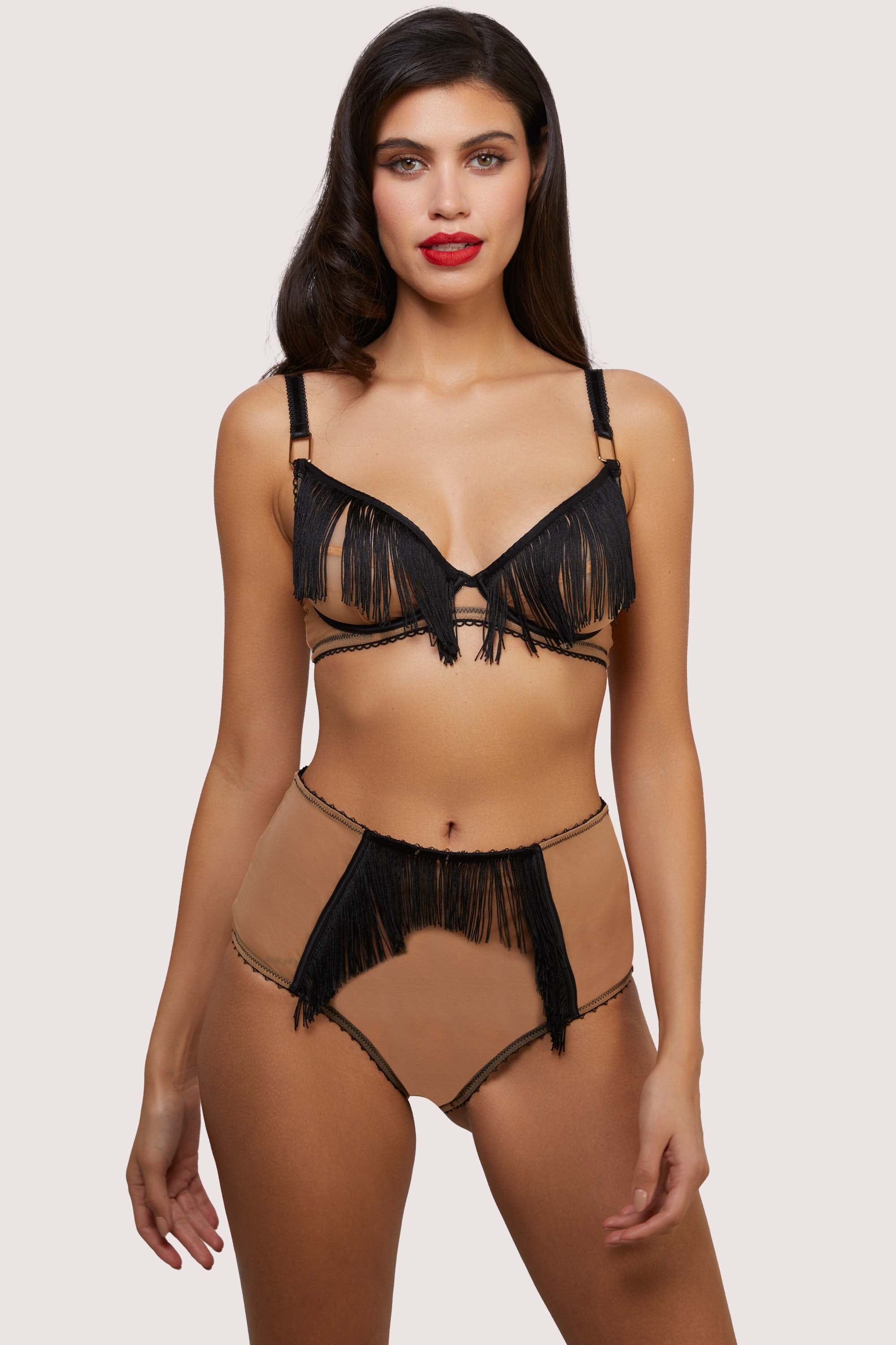 Model wears retro nude mesh and black fringe lingerie set