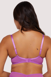 Model shows adjustable shoulder straps and hook and eye fastening back of purple plunge bra